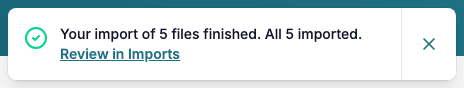 The message Your import of 5 files finished. All 5 imported, with the link Review in Imports.