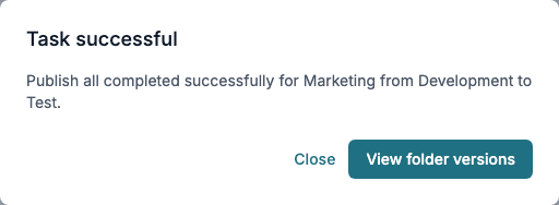 The Task successful dialog: Publish all completed successfully for Marketing from Development to Test, with Close and View folder versions.